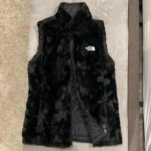 The North Face reversible puffer vest, fur side, nylon side, Black adult size XS